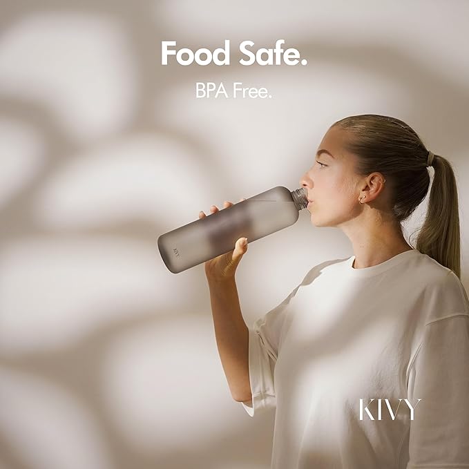 KIVY Slim Water Bottle 32oz [Lightweight & Shatterproof] Fits Cupholder & Backpack - Dishwasher safe water bottle no straw - Cute aesthetic water bottles screw top - Bpa free, Gold, White water bottle